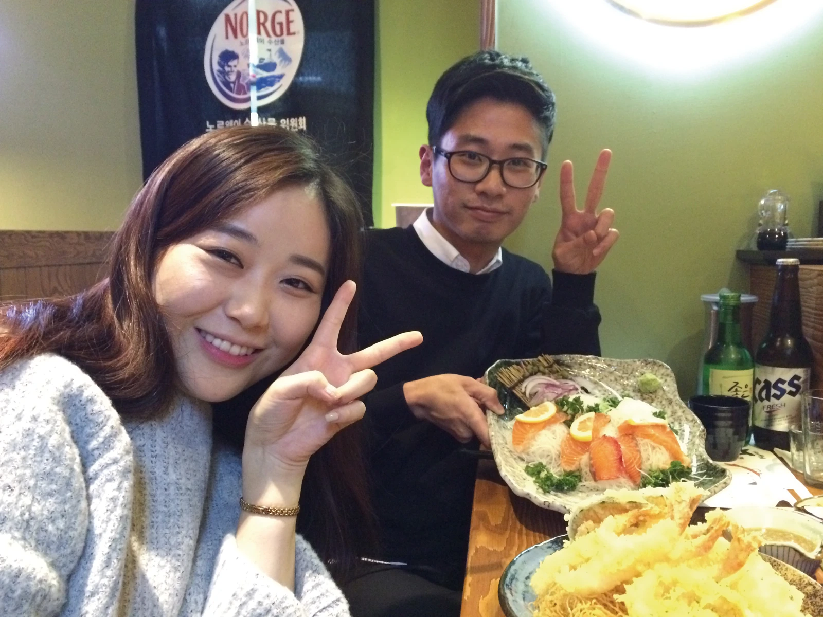 A girl and a boy enjoying Norwegian salmon in Asia - bravoseafood.no